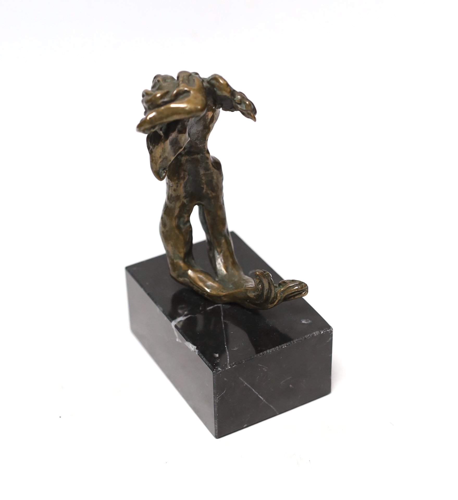 After Dali, a small bronze figure on marble base, 15cm